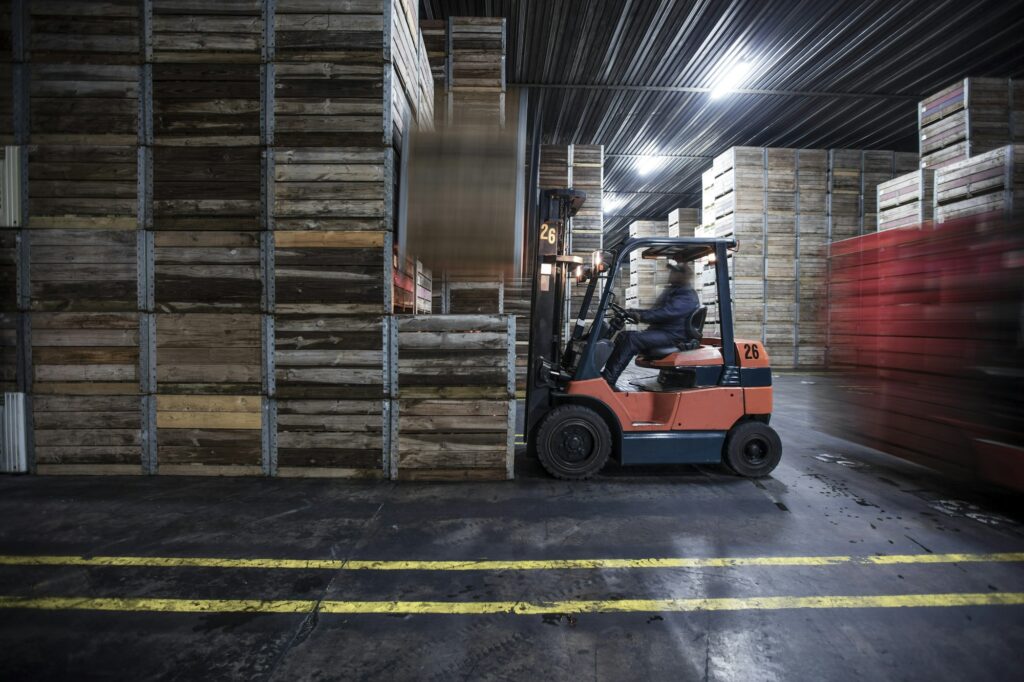 Man on forklift in factory hall