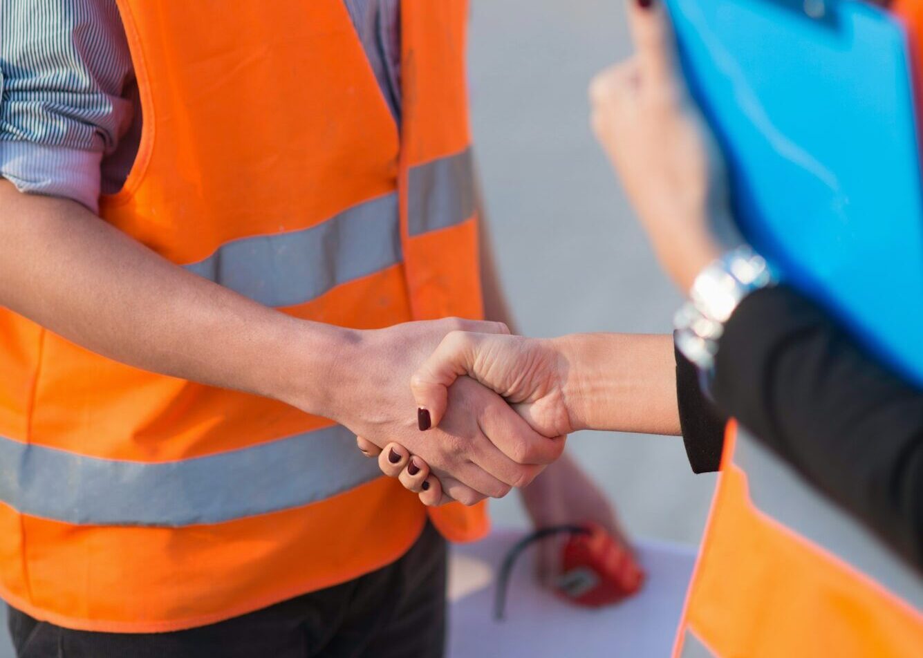 Handhaking on construction site